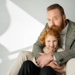bearded-father-hugging-redhead-son-in-knitted-jump-2023-11-27-05-00-51-utc_resized