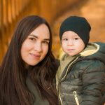 cute-little-asian-boy-stands-with-mother-outdoors-2023-11-27-04-59-59-utc_resized